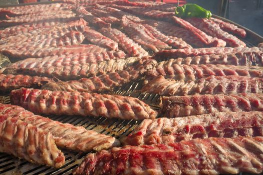 Pork ribs that have just put on the barbecue