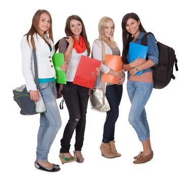 Studio shot of four female students isolated on white