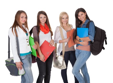 Studio shot of four female students isolated on white