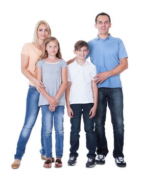 Portrait Of Happy Family With Two Children Isolated On White Background