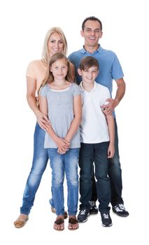 Portrait Of Happy Family With Two Children Isolated On White Background