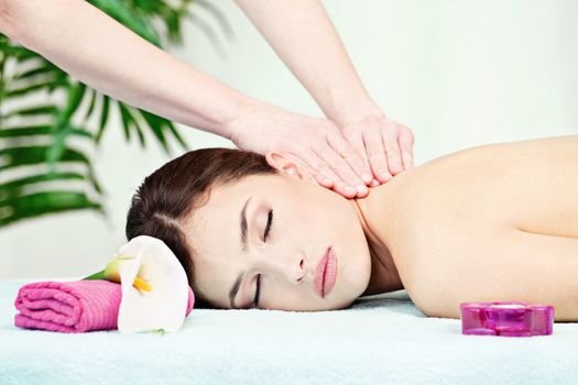 Woman on neck massage in salon