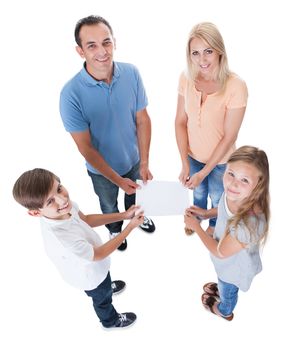 Elevated View Of Family With Two Children Holding Blank Paper Isolated On White Background