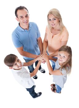 Elevated View Of Family Putting Hands Together Isolated On White Background