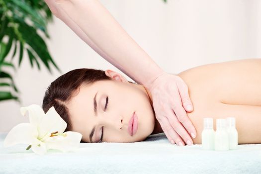 Shoulder massage in spa center