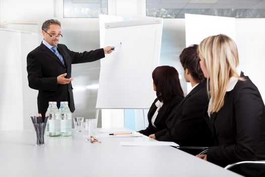 Group of business people at presentation in the office