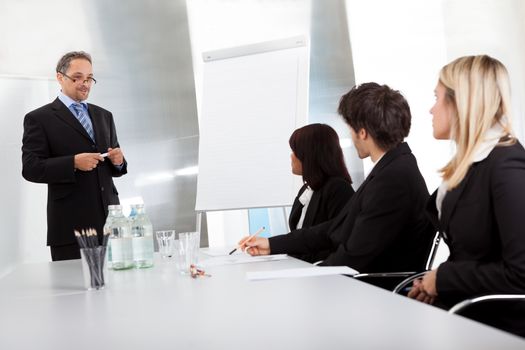 Group of business people at presentation in the office