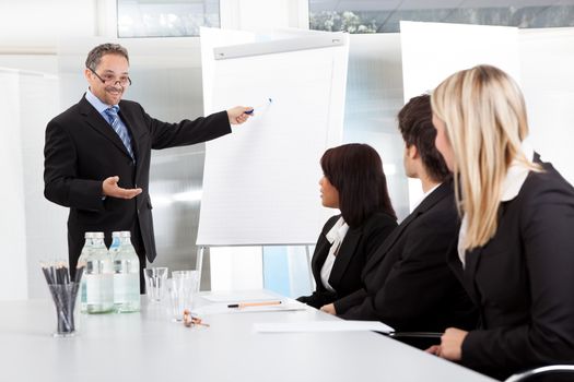 Group of business people at presentation in the office