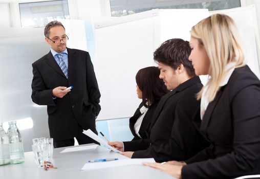 Group of business people at presentation in the office