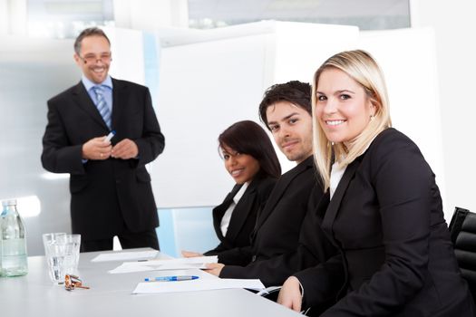 Group of business people at presentation in the office