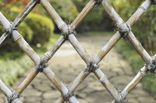 detailed bamboo fence with zen garden behind