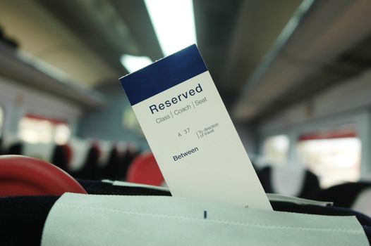 Pre-paid and reserved ticket attached to the seat