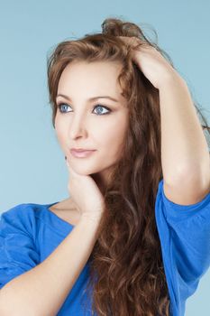 portrait of a young beautiful woman with brown hair and blue eyes