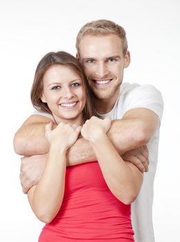 portrait of a happy young couple smiling, looking - isolated on white