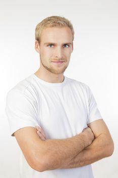 portrait of a young man with blond hair standing- isolated on white