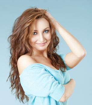 portrait of a young beautiful woman with brown hair and blue eyes smiling