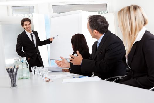 Group of business people at presentation in the office