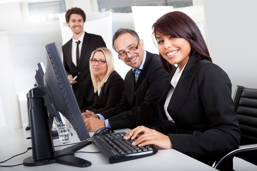 Group of business people in the office working on computers