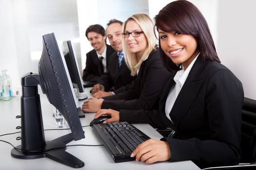 Group of business people in the office working on computers