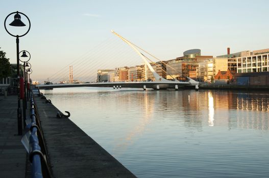 Samuel Beckett Bridge (Irish: Droichead Samuel Beckett) is a cable-stayed bridge in Dublin that joins Sir John Rogerson's Quay on the south side of the River Liffey to Guild Street and North Wall Quay in the Docklands area.