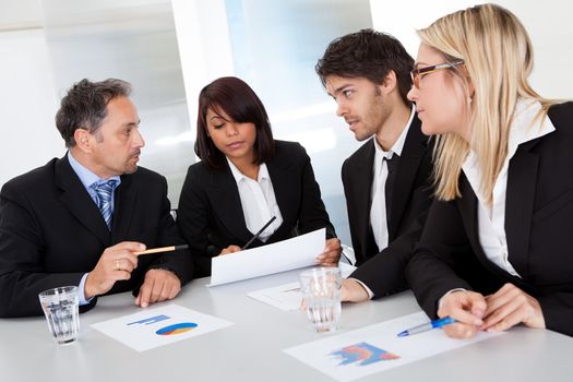 Group of business people at the meeting discussing