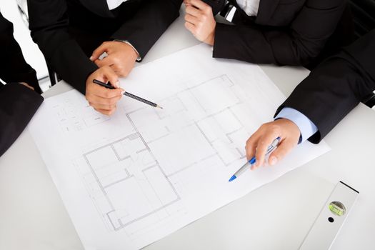 Group of architects at the meeting discussing the project