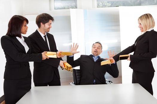 Portrait of happy businessman receiving gold bars