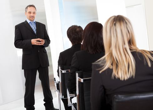 Group of successful business people at the lecture