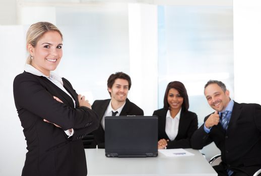 Portrait successful business woman and her team