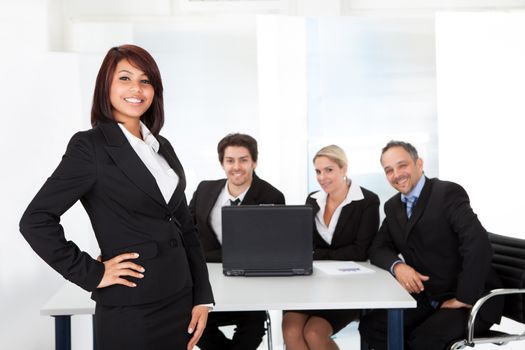 Portrait successful business woman and her team