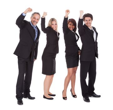 Group of happy business colleagues holding billboard isolated on white background