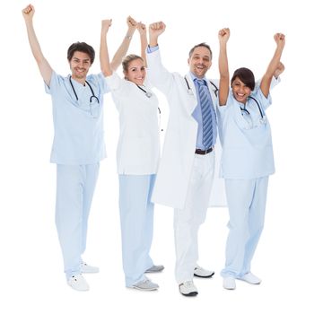 Group of doctors celebrating success. Isolated on white