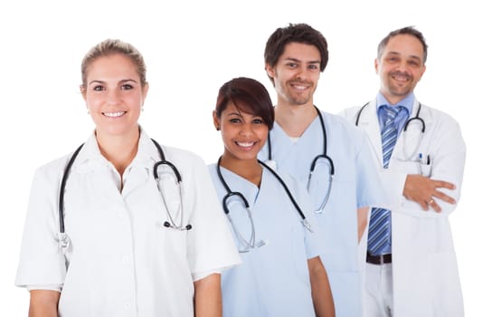 Group of doctors standing together isolated over white background