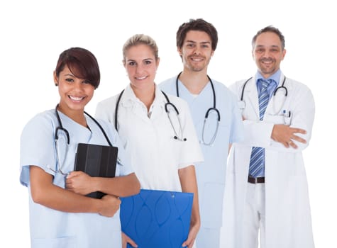 Group of doctors standing together isolated over white background