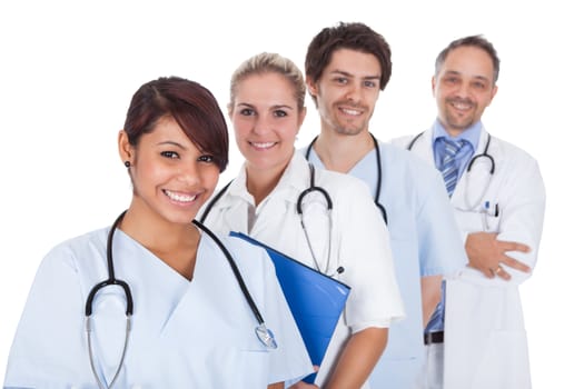 Group of doctors standing together isolated over white background