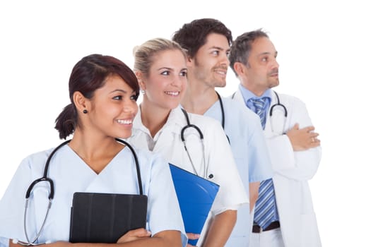 Group of doctors standing together isolated over white background