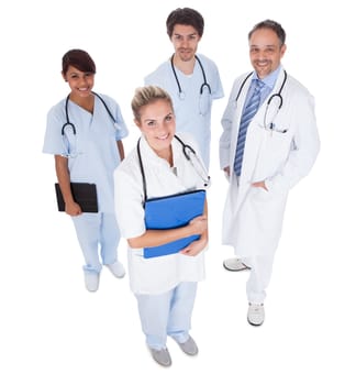 Group of doctors standing together isolated over white background