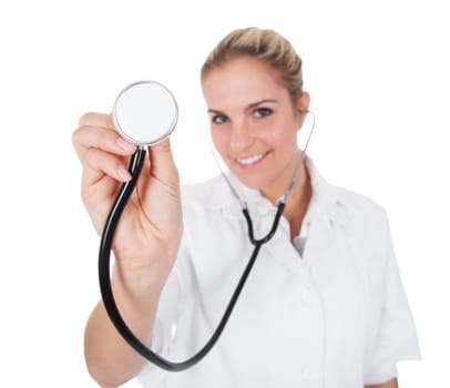 Cheerful  doctor with stethoscope examining. Isolated on white