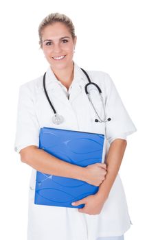 Smiling medical doctor woman with stethoscope. Isolated on white