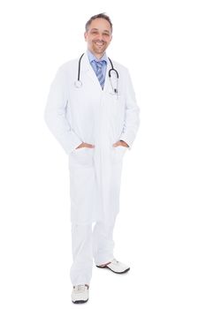 Smiling medical doctor man with stethoscope. Isolated on white