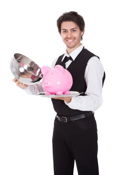 Portrait of a butler with piggybank on a tray. Isolated on white