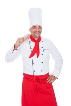 Portrait of a handsome cook. Isolated on white