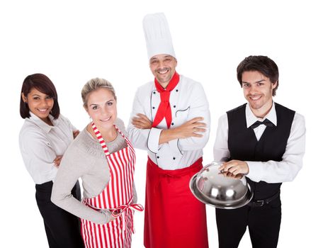 Group of restaurant chef and waiters. Isolated on white