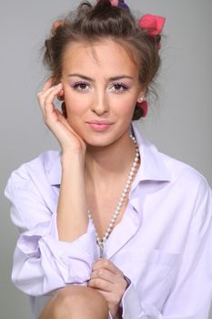 Beautiful young woman in gray background
