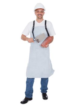 Portrait of smiling bricklayer. Isolated on white