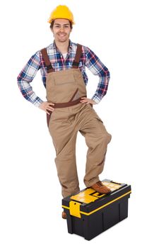 Portrait of repairman standing on toolbox. Isolated on white