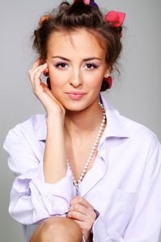 Beautiful young woman in gray background