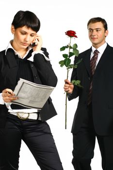 The business girl works and director tries to present it a flower
