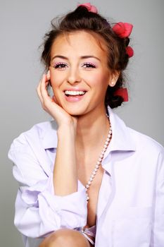 Beautiful young woman in gray background