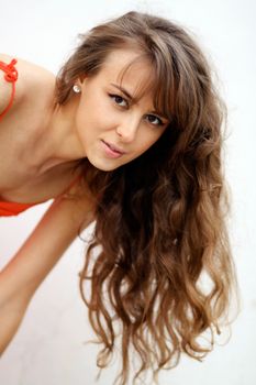 Beautiful young woman in gray background